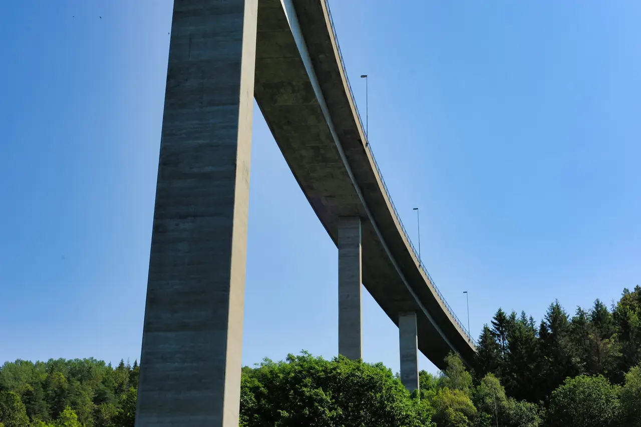 A concrete road bridge seen from below